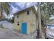 Exterior view of building with a yellow color scheme and access to off street parking at 659 26Th S Ave, St Petersburg, FL 33705