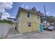 Exterior view of building with a yellow color scheme and access to off street parking at 659 26Th S Ave, St Petersburg, FL 33705