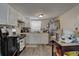 Compact kitchen showcases white cabinetry, stainless steel appliances, and a kitchen island at 659 26Th S Ave, St Petersburg, FL 33705