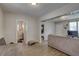 Spacious living room featuring laminate flooring, neutral paint, and a view into adjacent room at 659 26Th S Ave, St Petersburg, FL 33705