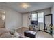 Cozy living room with durable laminate flooring, stylish decor, and a view of a front door at 659 26Th S Ave, St Petersburg, FL 33705