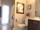 Neutral bathroom featuring decor, toilet, vanity, shower-tub combo, and tile flooring at 6804 Pleasant Oaks Pl, Riverview, FL 33578
