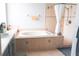 Bathroom showcasing a tiled bathtub and separate shower at 6804 Pleasant Oaks Pl, Riverview, FL 33578