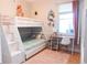 Bright bedroom featuring a bunk bed, desk, and a large window at 6804 Pleasant Oaks Pl, Riverview, FL 33578