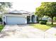 Charming single-Gathering home with well-manicured lawn and two car garage at 6804 Pleasant Oaks Pl, Riverview, FL 33578
