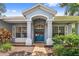 Inviting front entrance with double doors, brick walkway and manicured landscaping at 6804 Pleasant Oaks Pl, Riverview, FL 33578