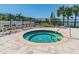 Relaxing community hot tub with a view of the lake, ideal for unwinding after a long day at 6804 Pleasant Oaks Pl, Riverview, FL 33578
