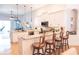 Modern kitchen with stainless steel appliances, granite countertops, and barstool seating at 6804 Pleasant Oaks Pl, Riverview, FL 33578