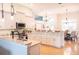 Bright, open kitchen featuring white cabinetry, granite countertops, and stainless steel appliances at 6804 Pleasant Oaks Pl, Riverview, FL 33578