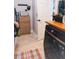 Tiled laundry room with washer, cabinets, counter space, and a door at 6804 Pleasant Oaks Pl, Riverview, FL 33578
