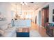 Open-concept living room flows into kitchen featuring hardwood floors and a stylish sofa at 6804 Pleasant Oaks Pl, Riverview, FL 33578