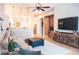 Comfortable living room with hardwood floors and a view of the kitchen area at 6804 Pleasant Oaks Pl, Riverview, FL 33578