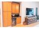 Built-in cabinets and a wine fridge provide ample storage and convenience in the living area at 6804 Pleasant Oaks Pl, Riverview, FL 33578