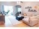 Bright living room with a sliding door, comfortable seating, and modern decor at 6804 Pleasant Oaks Pl, Riverview, FL 33578