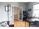 Cozy home office with french doors, wood floors, built in bar and views to outside at 6804 Pleasant Oaks Pl, Riverview, FL 33578