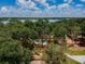 Aerial view of the community park, featuring a playground, seating area, and lush greenery, perfect for outdoor enjoyment at 6804 Pleasant Oaks Pl, Riverview, FL 33578