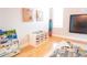 Spacious ' playroom featuring TV, bookshelves, and plenty of storage space at 6804 Pleasant Oaks Pl, Riverview, FL 33578