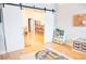 Playroom with double sliding doors, storage, and direct access to the kitchen at 6804 Pleasant Oaks Pl, Riverview, FL 33578