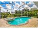 Screened-in pool and hot tub area, with a view of the pond at 6804 Pleasant Oaks Pl, Riverview, FL 33578