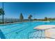 Inviting community pool with lap lanes, crystal-clear water, and comfortable lounge chairs, perfect for relaxation and exercise at 6804 Pleasant Oaks Pl, Riverview, FL 33578