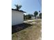 Spacious backyard featuring an expansive driveway and fence at 740 7Th Sw Ave, Largo, FL 33770