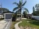 Backyard featuring lush landscaping, and outdoor dining area at 740 7Th Sw Ave, Largo, FL 33770