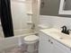 Bathroom featuring a white vanity and a bathtub with black fixtures, along with gray walls at 740 7Th Sw Ave, Largo, FL 33770