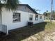 Exterior view showcasing a side of the home with access to the backyard at 740 7Th Sw Ave, Largo, FL 33770