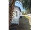 Exterior view showcasing a side of the home with access to the backyard at 740 7Th Sw Ave, Largo, FL 33770