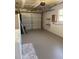 Spacious garage features laundry hookups, storage shelving, and overhead door at 740 7Th Sw Ave, Largo, FL 33770