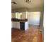 The kitchen features granite countertops, terracotta floors, white cabinets, and dark appliances at 740 7Th Sw Ave, Largo, FL 33770