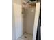 Enclosed shower stall with tile walls and a small circular tiled floor design at 740 7Th Sw Ave, Largo, FL 33770