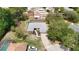Aerial view of home featuring a long driveway and a screened-in pool and spacious backyard at 7511 Laurel Oak Ct, Port Richey, FL 34668