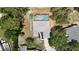 Aerial view of the house featuring the fenced in pool and putting green at 7511 Laurel Oak Ct, Port Richey, FL 34668