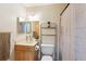 Traditional bathroom with decorative shelving above the toilet at 8720 Briar Patch Dr, Port Richey, FL 34668
