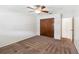 Bedroom with ceiling fan, carpeting, and a large closet at 8720 Briar Patch Dr, Port Richey, FL 34668