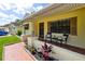 Cozy front porch with seating area, perfect for relaxing outdoors at 8720 Briar Patch Dr, Port Richey, FL 34668