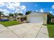 Inviting one-story home with a spacious driveway and a two-car garage at 8720 Briar Patch Dr, Port Richey, FL 34668