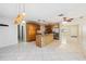 Expansive kitchen with large island, stainless appliances, and tile flooring at 8720 Briar Patch Dr, Port Richey, FL 34668