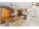 Well-equipped kitchen with a large island, stainless steel appliances, and tile floors at 8720 Briar Patch Dr, Port Richey, FL 34668
