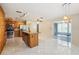 Open kitchen with granite island, stainless steel appliances, and ample storage at 8720 Briar Patch Dr, Port Richey, FL 34668