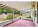 Enclosed porch area with a backyard view at 8720 Briar Patch Dr, Port Richey, FL 34668