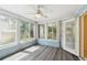 Enclosed sunroom with large windows offering plenty of natural light at 8720 Briar Patch Dr, Port Richey, FL 34668