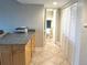 Hallway next to the kitchen with a granite countertop and storage area next to the bathroom at 880 Mandalay Ave # C412, Clearwater Beach, FL 33767