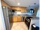 Cozy kitchen with stainless steel appliances, and granite countertops at 880 Mandalay Ave # C412, Clearwater Beach, FL 33767