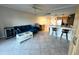 Inviting living room offering a cozy sofa, stylish coffee table, and breakfast bar seating at 880 Mandalay Ave # C412, Clearwater Beach, FL 33767
