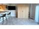 Open concept living space featuring a murphy bed, breakfast bar, and tv at 880 Mandalay Ave # C412, Clearwater Beach, FL 33767