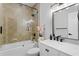 Stylish bathroom featuring a tiled shower, modern vanity, and black fixtures at 10003 Brompton Dr, Tampa, FL 33626