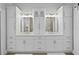 Elegant bathroom featuring a double vanity with white cabinets and gold hardware at 10003 Brompton Dr, Tampa, FL 33626