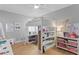 Whimsical bedroom with a loft bed, desk, and shelving, ideal for a creative space at 10003 Brompton Dr, Tampa, FL 33626